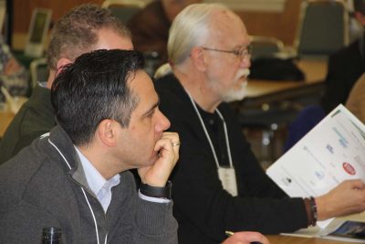 Some of the 50 municipal officials who attended the UConn Climate Adaptation Academy about low impact development listen during one of the presentations.