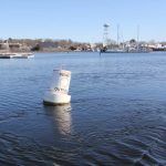 Treated effluent from the Mystic Wastewater Treatment plant flows into the Mystic River.