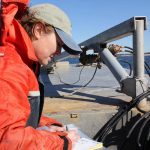 Kristin DeRosia-Banick records the time and date of the oyster sample collection.