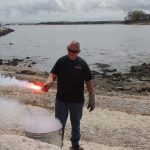 Ted Williams, marine safety coordinator with Hercules SLR Inc., shows one of several kinds of emergency flares.
