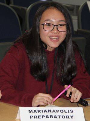 Rosa Nguyen, captain of the Marianapolis Preparatory School team, answers a question during the semi-final round of the contest.