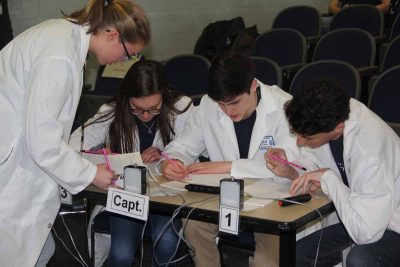 The team from the Bridgeport Regional Aquaculture school works on one of the written answer questions.