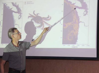 Parker MacCready of the University of Washinton shows an image of the ocean model he helped create during his plenary talk.