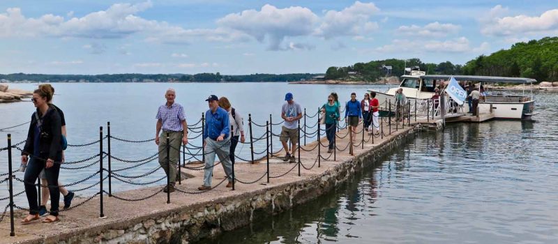 Passengers get off the Volsunga IV on the dock at Outer Island during an On-the-Water Workshop in Branford on June 7.