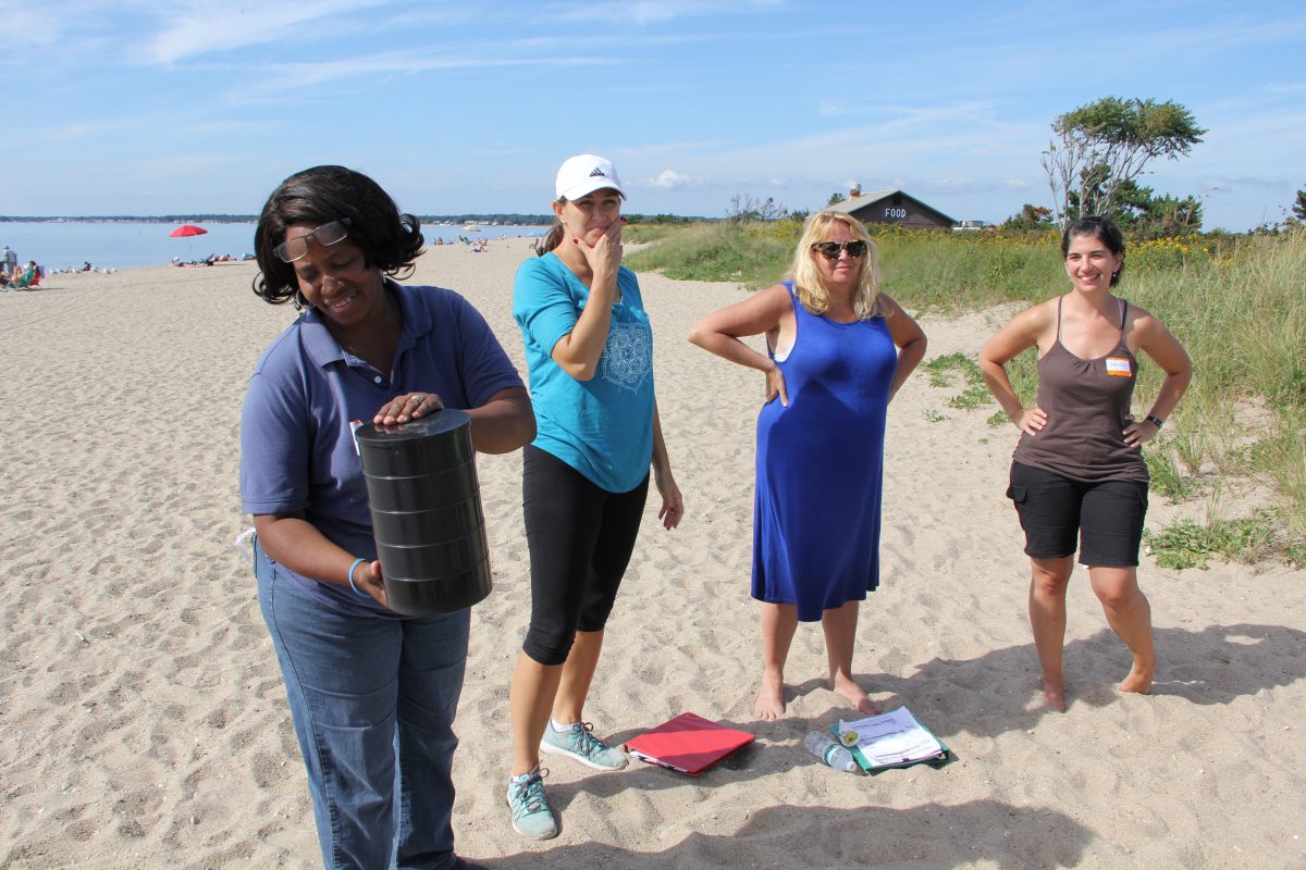Participants in the Long Island Sound Mentor Teacher program learn how to use a sifter for lessons about different types of sand during a workshop at Hammonassett Beach State Park in Madison.