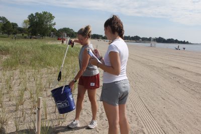 Emma Ofer, left, and Alex Ofer volunteered for the cleanup after they saw it advertised on Facebook.