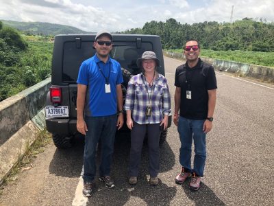Alicia Tyson with two representatives of PRASA, the water management authority of Puerto Rico, examine the geomorphic change following Hurricanes Irma and Maria.