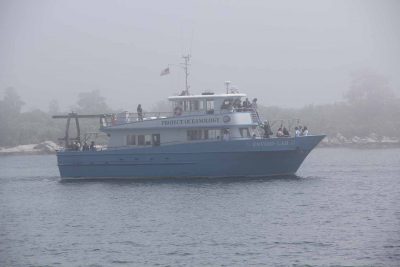 The Project Oceanology vessel Environlab III crosses in front of Pine Island through thick fog as it takes passengers on a tour of the CT NERR.