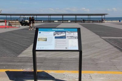 The CT Blue Heritage Trail sign at Ocean Beach Park in New London is located on the boardwalk.