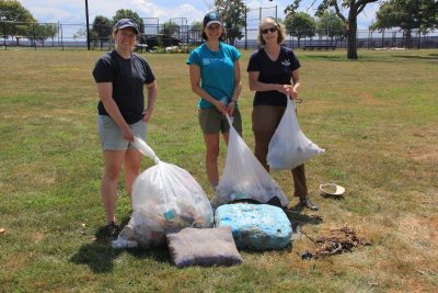 LeClair, left, Paltauf, center, and Judy Benson, communications coordinator for Connecticut sea Grant, show the bagfuls of trash and larger items they picked up at Seaside Park.