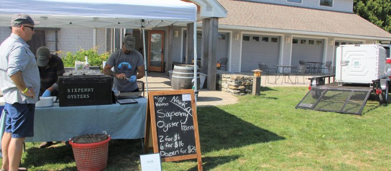 Far right, one of the 8 portable refrigeration units provided to small- to medium-sized oyster farmers this spring to enable them to directly sell their shellfish to customers at docks, farmers markets and festivals such as this one at Stonington Vineyards on Sept. 17.