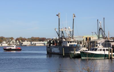 Several commercial fishing vessels are docked in New London.