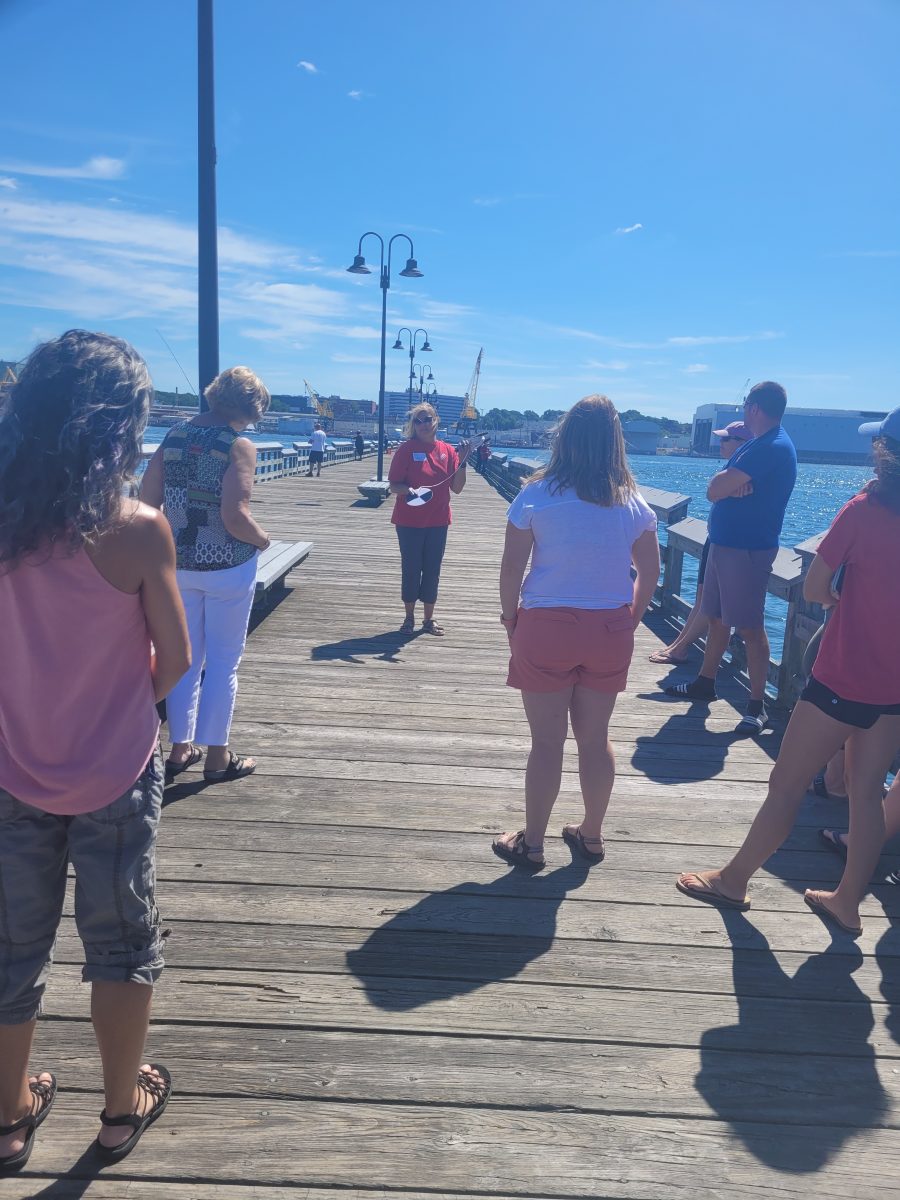 Teachers learn about a secchi disc at one of the 2022 Long Island Sound Mentor Teacher programs.
